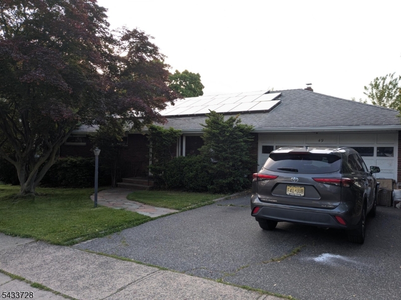 Rare opportunity Trifecta for buyers: 2 units + 2 car garage + 2 driveway parking spots. This brick ranch offers oversized rooms, a spacious park-like backyard, and a flexible layout ideal for all, guests. The eat-in kitchen features granite countertops, tile backsplash, ceramic flooring, skylight, and Anderson doors/windows opening to the patio and private yard for seamless indoor-outdoor living. The living room and bedrooms showcase maintained original hardwood floors, while every bedroom offers generous wall-to-wall closet space. The primary suite includes an additional walk-in closet and a private updated bathroom with a modern shower. Convenience meets functionality with first-floor laundry, a new pantry, access to 2 car garage, access to walkable attic, yard access, and an additional bathroom. The finished basement adds valuable living space with a large recreation room, storage, utilities, and French drains. A standout feature is the ground-level apartment with three spacious rooms and an updated bathroom, ideal for all, guests, work-from-home flexibility, or potential supplemental living space. Private Backyard features Fig and apple tree that make fruit, natural gas BBQ, covered picnic table, 2 sheds. Access to all Major highways within 8min or less
