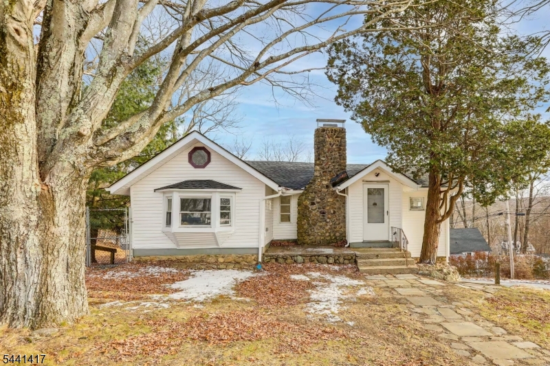 Beautifully updated 3-bedroom home offering a bright, open-concept layout and a perfect blend of modern updates and rustic charm. The main level features two spacious bedrooms, soaring vaulted ceilings, abundant natural light, and a stunning stone fireplace that serves as the centerpiece of the living and dining areas. The renovated kitchen boasts white shaker cabinetry, butcher block countertops, stainless steel appliances, and direct access to an expansive deck overlooking peaceful views?ideal for relaxing or entertaining. The lower level includes a third bedroom and a lounging area. Additional highlights include updated flooring, recessed lighting, a one-car garage, and a private setting surrounded by mature trees.Conveniently located near shopping, dining, schools, and major commuter routes, this home also offers easy access to outdoor recreation, including hiking, fishing, boating, and year-round activities at nearby lakes, parks, and ski areas. This beauty delivers comfort, character, and a great location in the heart of Sussex County.