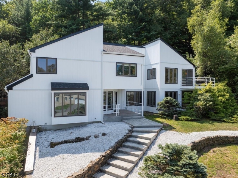 Welcome to this spacious 4,400 sf & modern 4-bedroom, 3.5-bath property, offering peace of mind & effortless living from day one. Inside, the generous layout provides a clean, neutral palette, an open invitation for you to customize every detail to reflect your personal style, including freshly sanded floors throughout the common areas and new hardwood floors in the primary bedroom, both ready to be stained to the color of your choosing before you move in at the owner's expense. The owner invested heavily into property last summer. The outside of the home has been fortified with a new roof (25-yr guarantee), new batten board siding & gutter system (15-yr guarantee), new exterior lighting, & a refurbished & freshly painted deck. The appliances have been updated to include two new furnaces, AC condenser, & pool pump and filter.  The interior of the home has been updated with freshly painted common areas. The house itself features high ceilings & natural light with multiple skylights & large windows throughout, highlighting the flexible living spaces perfect for both relaxation & entertaining. Outside, the groomed & manicured landscaping creates beautiful curb appeal, while the expansive backyard offers endless possibilities for outdoor living & entertaining. Every inch of this home has been carefully prepared so you can move right in & take your time imagining your dream design. This is more than a home; it's a blank canvas in an ideal setting, ready for your vision.
