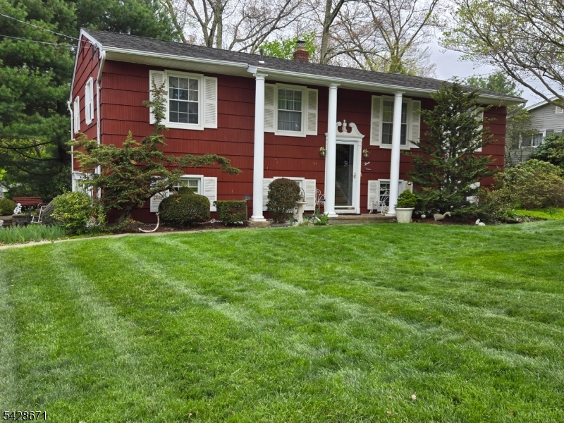 PRICE IMPROVEMENT! Incredible Value in The White Rock Lake section of Oak Ridge! Don't miss this newly priced opportunity to own an impeccably maintained, move-in-ready bi-level home perfectly situated just steps from the lake in Oak Ridge's highly desirable White Rock community. The exterior immediately charms with its striking red siding and meticulously manicured gardens that burst into a stunning display of spring blooms, while the pristine interior features a warm, sun-drenched layout with 3 spacious bedrooms and 1.5 immaculate bathrooms. Downstairs, a fully finished lower level boasting its own separate entrance and direct garage access provides incredible versatility, offering the perfect setup for a family room, an expansive home office, or a potential 4th bedroom. Complete with a peaceful, garden-filled yard ideal for outdoor relaxation, this solid home offers ultimate peace of mind with the rare convenience of public water, public sewer, included garbage pickup, and a natural gas hookup available right in the street. This beautifully kept property represents unbeatable value in today's market freshly priced, easy to show, and ready for you to schedule your private tour today!