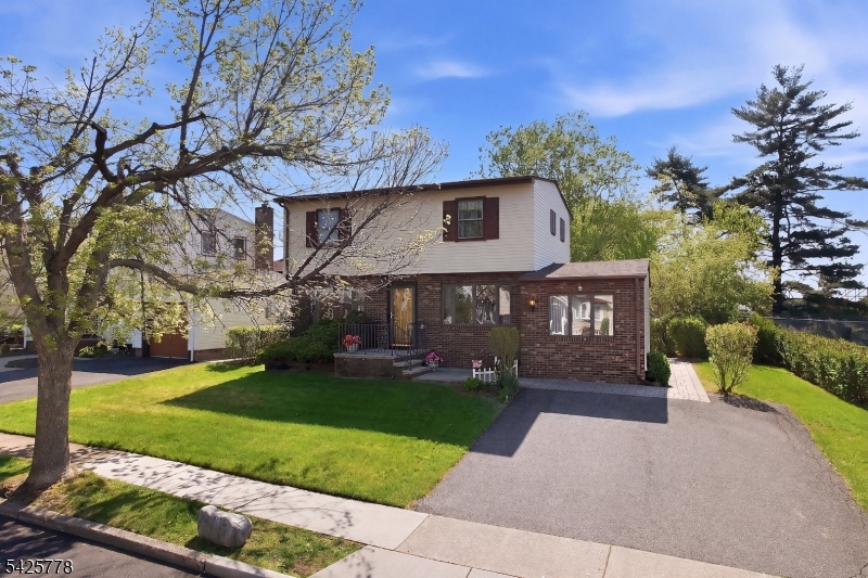 GREAT LOCATION! Just a quick & convenient commute to NYC and minutes to the train station, MetLife Stadium & the American Dream Mall.  Nestled in a prime neighborhood near shopping and restaurants, this 4 bedroom Colonial offers a spacious living room, formal dining room, eat-in kitchen and 1.5 baths. A versatile bonus room off the kitchen provides the perfect space for a den or playroom. The basement is great for entertaining and extra storage. Situated on a beautiful lot with a landscaped backyard and paver patio, this home also features central air, a newer roof (2020) and hot water heater (2024) and updated electrical (2024). Don't miss this wonderful opportunity to make this your forever home!!