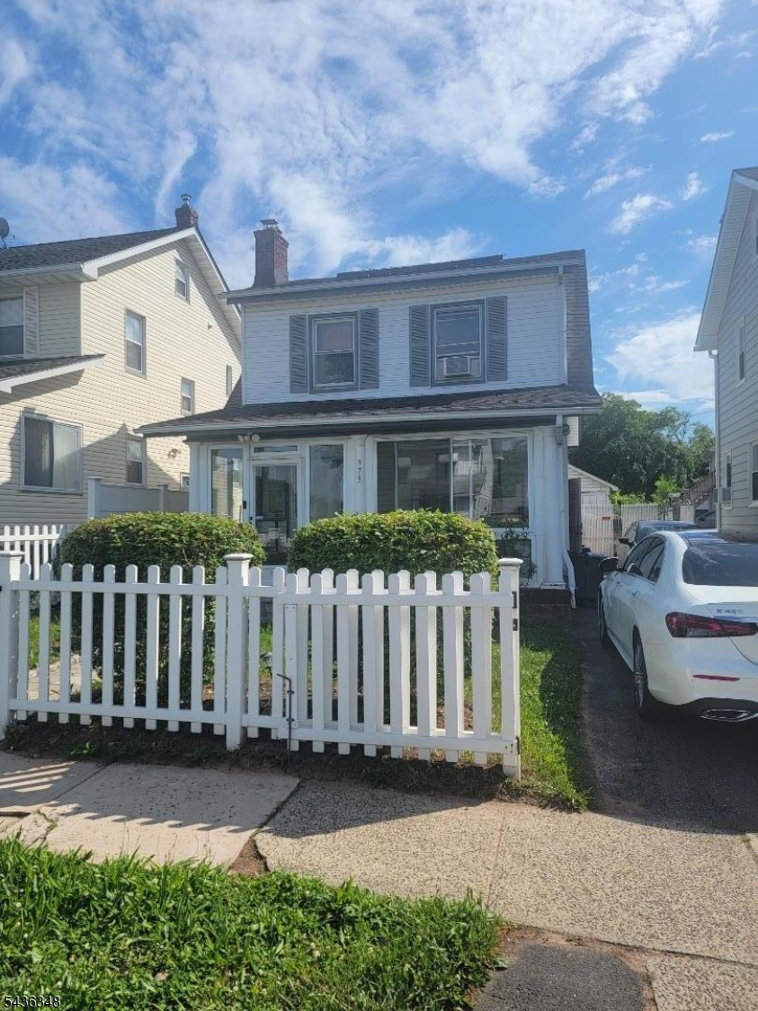 Welcome to this beautiful and spacious Colonial home, perfectly situated on a quiet residential street near the Bloomfield border! From the moment you arrive, the charming enclosed front porch welcomes you in, offering a perfect spot for morning coffee. Inside, you will find an inviting open-concept layout featuring a bright living room, a formal dining area, and a functional kitchen equipped with a convenient breakfast bar. The second floor boasts three comfortable bedrooms and a full main bathroom. Need extra space? The fully finished basement is a major highlight, complete with a recreation room, an additional full bathroom, a dedicated laundry room, and plenty of built-in closet storage. Step outside to a private backyard featuring a patio ideal for outdoor dining, alongside a detached garage and a private driveway. Conveniently located just minutes from the Garden State Parkway, local transit options, shopping, and schools. This move-in ready gem is the perfect place to call home!