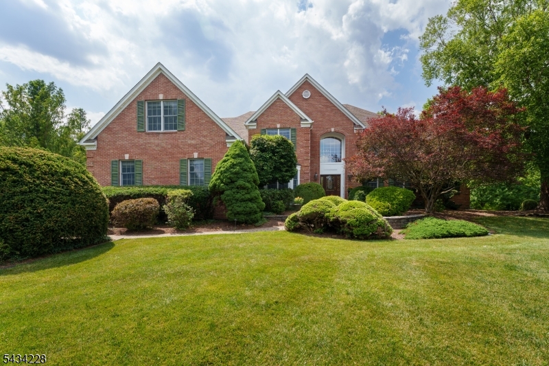 Boasting a prime cul-de-sac position, on over 5 park-like acres, among similarly impressive homes, this handsome Traditional offers an abundance of space warmed by timeless detailing. Hardwood floors, custom window treatments and refined crown molding set an elegant tone throughout the generously scaled rooms, including a versatile billiards room. The eat-in kitchen offers Viking appliances and an open view into the cathedral-ceiling family room with a gas fireplace. A powder room tiled in luminous natural stone, a large mudroom and extra walk-in storage add everyday convenience next to the 3-car garage. Take the sweeping main staircase or the handy back stairs up to four bedrooms, including the main suite crowned with a tray ceiling. Radiant heat, a slipper tub and an oversized steam shower are spa-level perks in the main bath. Another updated bath with eye-catching tile joins two bedrooms with access to a cheerful playroom. Brand new carpeting leads the way to a beautifully finished walk-out basement designed for effortless entertaining. It includes a gas stove, full bar, wine closet, and a tucked-away guest bedroom, with access to a sauna within a full bath. A separate gym opens to the outdoors. All this comfortable space comes with the added benefit of top-rated Montgomery schools!