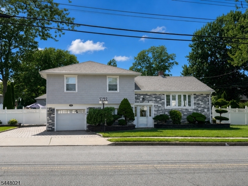 Absolutely stunning split level situated in the popular town of Clark! From the minute you enter the leaded glass front door to the foyer you will be captivated by the upgrades and improvements that have been done. The spacious living room has a Heatilator gas fireplace with a granite top. The formal dining room offers the perfect space to entertain. The newer kitchen has custom cabinets, granite counters & Stainless steel appliances. There are 3 bedrooms and 2 full bathrooms that are a must see to believe. The family room offers a bar and movable keg as well as an electric fireplace and radiant heat. The finished basement is beautiful and offers the perfect den. Upgrades include the windows, newer roof, siding and brick exterior, deluxe pavers and a Kolar generator and a sprinkler system. There is a humidifier throughout and a dehumidifier for better air quality. Best of all is the large backyard with an inground pool with a brand new liner and a safety cover plus a Polaris pool cleaner and a paver patio and all around pool pavers, outdoor lighting, 2 sheds and a Weber grill. The list of included items is endless including 5 TV's. This is a home you don't want to miss! Professional pictures coming soon