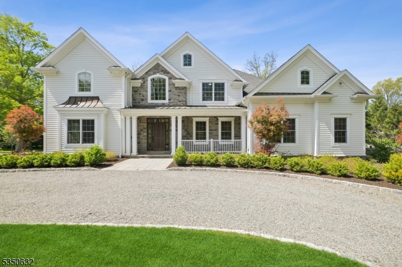 Ideally located on prestigious Hartshorn Drive, this extraordinary 7 Bedroom Colonial with John James AIA designed renovations has the perfect floor plan with grand 2-Story Entrance Hall, 9' high ceilings on the 1st & 2nd levels, bright living room, elegant dining room, butler's pantry w/ wet bar, stunning new gourmet eat-in kitchen w/ huge center island, custom cabinetry, marble countertops, Subzero, Viking and Bosch appliances, window seat, walk-in pantry, open to the family room with gas fireplace flanked by wall of bookshelves, coffered ceiling & easy access to terrace from sliding glass doors perfect for al fresco dining. Has a huge inviting in-law suite with 2 walk-in closets, a sunlit office, & a beautiful full bath w/ shower, Jacuzzi & bidet. There is an additional 1st level bedroom w/ en suite bath. Convenient 1st level laundry room. 2nd level features a new luxurious Primary Suite (2024) w/ 16' high vaulted ceiling, gas fireplace, massive custom walk-in closet, spa-like bath w/ Victoria & Albert soaking tub, shower, & double sinks, as well as 3 more spacious en suite bedrooms. The lower level has a nanny's suite w/ kitchenette, rec room, mudroom to 3 car garage & great natural light in huge exercise room w/ mirrored walls & French doors that open to Bluestone patio & spectacular property w/ plenty of room for a pool! Smart home features & great amenities. Close to highly rated Hartshorn Elementary School, Short Hills Train Station & Gero Park, the town's rec center!