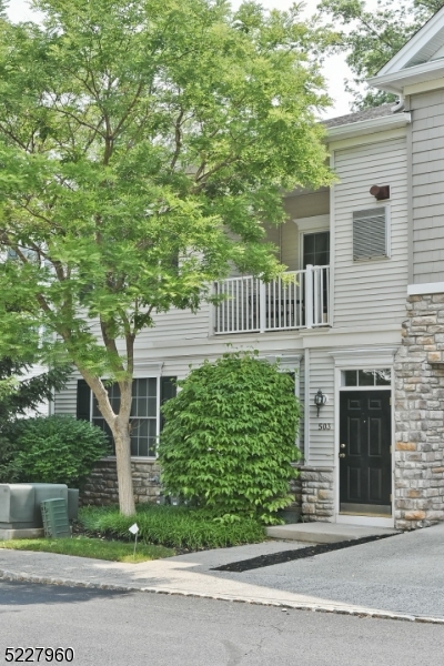 Bright & Airy End unit Townhouse in "The Grande". Open bright floor plan, Gourmet kitchen with granite counters, S/S appliances with 42 in. cabinets, breakfast bar Entertain or relax in the living room with soaring ceilings and dining room. Private balcony situated off of dining room. Spacious Living Room and Dining room. Full bath, Guest Bedroom with large walk-in closet and Laundry nook complete this Main level (washer & dryer incl.), Hardwood floors on main level. Second floor-Spacious hallway leading to Master suite huge walk-in closet (California closet), full bathroom-large shower. Carpet in bedrooms. Whole house Water softener and filtration system and floored attic space for more storage and a one car garage complete this not to be missed townhome! 1400 sq ft according to tax records