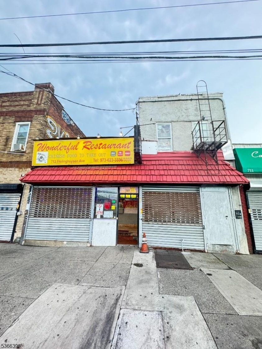 Mixed-Use Commercial Building with Restaurant & 2-Bedroom Apartment located directly across the street from a major upcoming development site -- the future home of the 12-acre TV and Film Complex by Great Point Studios and Lionsgate, in partnership with the NJ Performing Arts Center.  Situated on a high-traffic street with a bus stop right in front, this prime investment opportunity offers excellent visibility and accessibility.
