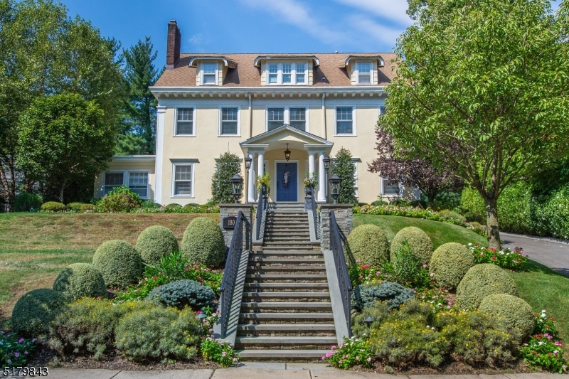Totally renovated top to bottom in 2014, this stunning, move-in ready, 7 bed, 3.1 bath center hall colonial will take your breath away from the curb. Once inside, the stately foyer with grand staircase will welcome you home. First floor includes spacious kitchen running the depth of the house. Oversized island with caesarstone quartz counters, La Cornue double oven, convection oven, 2 sinks, 2 dishwashers, wine fridge and prep space galore. A very large in-kitchen dining space overlooks the front yard. Custom mudroom and butler's pantry off the kitchen provide extra storage. The formal living room with newly restored, converted gas fireplace opens onto the elegant dining room with curved ceiling and Farrow and Ball wallpaper. Family room / play room is just beyond. At the top of the stairs, glorious landings including window seat overlooking the yard. 4 very generous beds with custom closets on the 2nd floor including a stunning en suite primary with a large soaking tub, oversized shower and double vanity. Third fl has a home office, two more large bedrooms and another full bath. Once the house knocks your socks off on the inside, time to step outside to a perfect oasis with bluestone patio, new, high end outdoor kitchen, fireplace, two tiered yard with spectacular landscaping front, back and sides, making the home feel like a serene, private vacation. Perfect location, so close to Watchung Plaza, downtown, Edgemont and Anderson Parks, trains, buses and so much more.