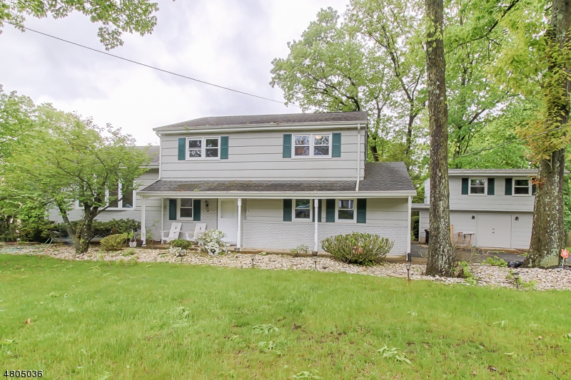 Beautiful split level home on a quite tree lined street on one of Pine brooks most sought after neighborhoods. This 4 BR 2.1 Bath home has hardwood flooring thru out most rooms, a nice size laundry room with utility sink, L shaped Galley kitchen with stainless steel appliances and sliders to trex deck with fantastic views. 4th Bedroom/ Office is located on the first level with sliders to the very private back yard. The outbuilding located right next to the home has a nice workers bench with plenty of storage closets. Stairs that lead to the upper level can be used as a home office or artist studio or whatever you'd like it to be! Tenant responsible for the first $100 of repair. Home needs to be professionally cleaned by tenant after moving out.