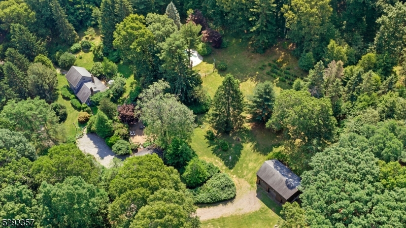 Beautiful Country estate for sale for the first time in 53 years, a sprawling 22.5-acre estate with a picturesque four-bedrooms, three full bath charming home with hardwood floors, fireplace and wood burning stove. Additionally, the property affords antique stone walls, brick patios, a large stone well house, a cedar log cabin barn with two large truck bays underneath for all your equipment and room above for hobbies and activities, a detached two car garage and riding trails throughout the property. The unmatched landscaping with historic plantings and flowers surround the quaint home and many rambling lawn areas, one which is large enough for hosting big tent events and gatherings. This is a wonderful opportunity to own a prized estate with low taxes through forestry assessment in beautiful Long Valley with excellent schools and close to highways, commuter trains and stores. Opportunities for horses and other animals, hiking, sleigh riding, hunting and ATVing or just relax take in all the quiet and nature that surrounds you. Shown by appointment only. An updated septic system meeting current code requirements will be installed at owners' expense.