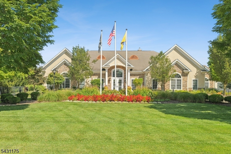 Welcome to resort-style living, where everyday life feels a little more elevated. Set among beautifully maintained grounds with tree-lined walking paths and exceptional amenities, Four Seasons Promenade offers a lifestyle that can only be described as relaxing and refined. This first-floor, true one-level condo combines comfort, style, and convenience with an open-concept layout that connects the kitchen, dining, and living areas. Hardwood floors throughout create a warm, cohesive feel, while large windows fill the space with natural light. The kitchen features creamy white cabinetry, quartz countertops, stainless steel appliances, and an island with breakfast bar at the heart of the home. The spacious primary bedroom offers an updated ensuite bathroom and walk-in closet. A 2nd bedroom, full bath, and in-unit laundry add flexibility and convenience. The covered porch extends the living space outdoors. Additional upgrades include recessed lighting throughout the main living areas, a newer CAC system, and updated appliances for added comfort and peace of mind. At the center of the community is the newly renovated clubhouse, the social and recreational hub of Four Seasons Promenade, a 55+ community. Residents enjoy a fitness center, heated outdoor pool, bocce, billiards, concierge service, and a vibrant calendar of social activities. Whether it is a morning workout, an afternoon by the pool, or an evening stroll through the neighborhood, life here feels effortlessly enjoyable.