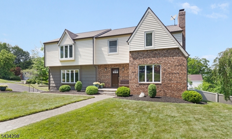 Move right into this fabulous 4 bedroom, 2 full and 1 half bath Colonial in a fantastic location! Beautifully maintained and updated throughout, this home offers spacious rooms, hardwood floors, recessed lighting, crown molding and custom details. The spacious eat-in kitchen features custom cabinetry, stainless steel appliances and opens to a fabulous adjoining family room, along with formal living and dining rooms perfect for everyday living and entertaining. The primary suite offers a full bath, dual closets and sitting area, while three additional generously sized bedrooms provide ample closet space, a reading nook and an updated hall bath. The finished walk-out lower level adds flexible living space, recreation, office and abundant storage. Recent improvements include a new furnace (2025), sump pump (2025), dishwasher (2024), front siding (2023), hot water heater (2021), updated chimney, attic insulation and cleaning, and newer roof (2019). Additional highlights include a first floor laundry/mud room, double deck overlooking the fenced yard, professional landscaping and a 2 car garage. Conveniently located less than 2 miles from the Midtown Direct train and vibrant downtown Morristown, with easy access to schools, restaurants, shopping, parks and major transportation