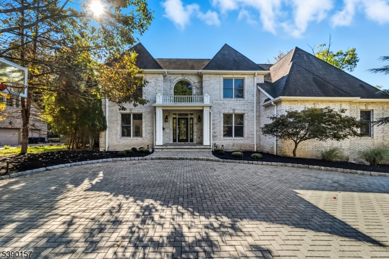 Welcome to 32 Moeser Place, a beautifully renovated home in the desirable community of Old Tappan, New Jersey, located within the town's highly sought-after Blue Ribbon school district. This charming residence blends classic appeal with modern updates, offering comfort, style, and functionality throughout. Step inside to find a freshly painted interior that creates a bright and inviting atmosphere. The main living areas feature refinished and beautifully stained hardwood floors, adding warmth and elegance to every room. The updated kitchen is the heart of the home, showcasing sleek countertops, modern cabinetry, and stainless steel appliances perfect for everyday living and entertaining. Thoughtful renovations extend throughout, giving the entire home a fresh, move-in-ready feel. Natural light floods the living spaces, enhancing the home's airy ambiance. The flexible layout provides plenty of room for both relaxation and gatherings. Enjoy a cinematic experience in your private, high-end Dolby Atmos 4K theater featuring tiered seating for 10 fully included. Outside, enjoy a spacious yard ideal for outdoor living, gardening, or play. Located on a quiet street in a sought-after neighborhood, this property offers the perfect combination of privacy and convenience, with nearby parks, schools, shops, and dining.