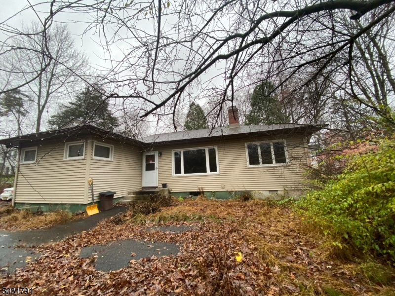 Bring you imagination & revitalize this home.  Mid Century 3 bedroom ranch in need of repairs.  Hardwood floors, Fireplace in LR.  Being sold "as is".  Cash or 203K only.  Above ground Roth oil tank. Update Boiler 2008, Roof & Siding 2011.  Replacement windows 2012. Well pump 2018.  Subject to 3rd party approval.