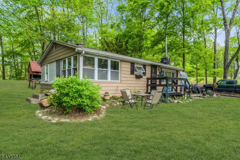 Welcome to the beautiful lake community of Crandon Lakes and discover the perfect ranch-style retreat! Whether you're searching for an affordable first home, weekend getaway, or peaceful year-round residence, this move-in ready home offers comfort, charm, and low taxes in a quiet private lake setting. Thoughtfully updated throughout, this home features a roof approximately 5 years old, a septic system installed in 2007, and a newer split-unit system providing efficient heating and air conditioning. The fireplace was professionally cleaned in 2025, and newer appliances including the refrigerator, dishwasher, washer, and dryer are all included with the sale. Interior improvements include new sheetrock ceilings, custom wood trim, along with newer luxury vinyl plank flooring throughout the kitchen, dining room, and living room. The spacious kitchen offers a center island with beautiful butcher block countertops and a built-in cooktop, perfect for entertaining or everyday living. Enjoy everything Crandon Lakes has to offer with incredible community amenities including two private beaches, picnic areas, playgrounds, a community garden center, soccer and basketball courts, boating, kayaking, fishing, and live music weekends from Memorial Day through Labor Day.Come experience stress-free lake living and make this summer your best one yet!