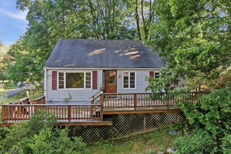 Handyman Special! Instant Equity To Be Earned! Welcome to 15 Roosevelt Avenue in Port Murray, NJ, offering a fantastic opportunity! This home needs some TLC but has incredible potential. The exterior features a private driveway, an oversized 2-car garage, a large deck, and a peaceful neighborhood setting. The main level offers a lovely living room, spacious dining area, nicely sized kitchen, three bedrooms, and one full bathroom. The second level features a large fourth bedroom along with additional living space. The lower level includes a full basement, perfect for storage or ready to be finished for even more living space and added value. The home is being sold in as-is condition, and the seller will make no repairs. The property will require a new septic system, and it has been priced accordingly. Opportunities like this are becoming increasingly rare in today's market, making this an exceptional value-add investment. Location is key! Situated in Washington Township, Morris County, this home offers the perfect combination of privacy, convenience, and access to highly rated schools, including West Morris Central High School. Enjoy being just minutes from shopping, dining, and major highways, while also taking advantage of all that Long Valley has to offer, including fresh air, golf courses, and outdoor recreation at Hacklebarney State Park with hiking, biking, and fishing. This home has so much to offer and won't last long. Call today to schedule your private showing!