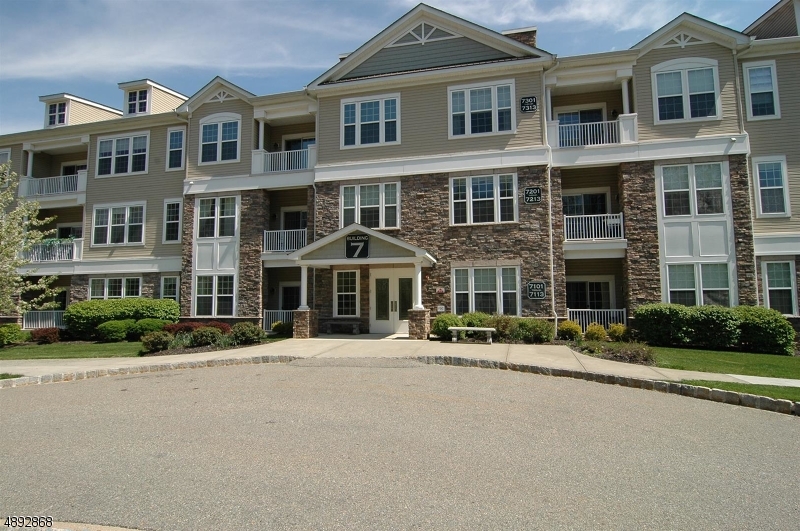 Welcome to Greenbriar at Fox Ridge! Come see this sun-filled, beautiful, 2 bedroom, 2.5 bath Ramapo model on the 1st floor. The oversized primary suite boasts two walk-in closets, large granite-topped vanity, and walk in shower. Newer wall mounted TV included. An equally impressive second bedroom has its own full bathroom and walk in closet. Kitchen has granite countertops, matching stainless steel appliances with accompanying breakfast bar. A well-lit den off living room gives ample opportunity for an office. Side by side new washer and dryer in unit. Garage parking with extra 10' x 10' storage unit. Plus everything this idyllic community has to offer including large clubhouse with heated indoor pool and sauna, a fitness center, art room, billiards room, card/activity room, outdoor pool with a pavilion, tennis & pickleball courts, dance/aerobics studio, community garden with individualized plots, hiking trails and much more! Short drive to Rockaway Mall, dining, endless activities. NYC is just under an hour away. As is sale. Some photos virtually staged; Primary bedroom carpet was removed and replaced with matching wood laminate after photos taken.