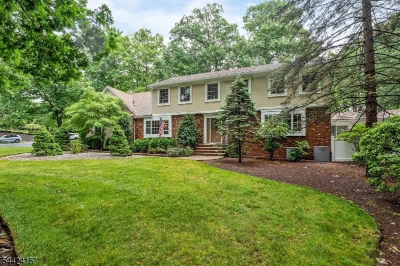 Exceptionally spacious colonial, ideally situated on a beautiful, quiet, tree-lined street in one of Wayne's most desirable neighborhoods within the highly sought-after Wayne Hills High School district. Set on a large corner property, this impressive 5-bedroom, 3 full and 2 half bathroom home offers an outstanding layout, generous room sizes, and an incredible backyard retreat featuring a heated gunite pool. A welcoming foyer opens to expansive living spaces. The main level features a large LR, formal DR, impressive great room with gas FP, sunroom overlooking the backyard, spacious kitchen, mudroom w. laundry, powder room, and access to the attached 2 car garage. The 2nd level offers exceptional bedroom accommodations, highlighted by a spacious primary suite with a WIC and private bath. A rare second en-suite bedroom offers outstanding flexibility. 3 additional bedrooms share a full hallway bathroom. The finished basement offers a large rec area, powder room, utility room, additional laundry area, cedar closet, and central vac system. Additional highlights include two-zone central air conditioning, multi-zone baseboard heating, security cameras and alarm system, an attached 2-car garage, and an outdoor storage shed. Combining exceptional space, a versatile floor plan, and a prime Wayne location, this is a rare opportunity to own a truly remarkable home.