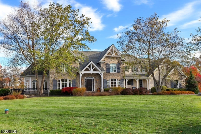 Including the furnished lower level, this elegant custom 5 bedroom, 6.5 bath home offers approximately 8,000 sqft. of living space combining timeless architecture with modern comfort. Inside, you'll find spacious living areas and abundant natural light. The kitchen offers commercial-grade appliances and ample counter space while the floor plan makes entertaining effortless. Each bedroom features its own bathroom access, creating privacy and convenience for guests. The property's grounds provide a private retreat with endless possibilities from intimate gatherings to expansive outdoor entertaining or gardening, a large driveway and 3-car garage ensure plenty of parking. Recent upgrades include: Home Gym (2023), 3 New Air Handlers (2024), Upgraded Electrical System (2023), Custom Audio System ($100,000+ in 2023), 2nd Outdoor Hot Tub (2022), 24' Flag Pole (2025), New Water Heater (2022), Expanded Parking Area (2023), New Pool Heater (2022), Upgraded Outdoor Lighting (2025), Custom Storage Shed (2024). The home is close to top-rated schools, local parks, and offers an easy commute to both New York City and Philadelphia. This move in ready home is a rare opportunity to own a spacious, well-appointed property in one of Hunterdon County's most sought-after neighborhoods.