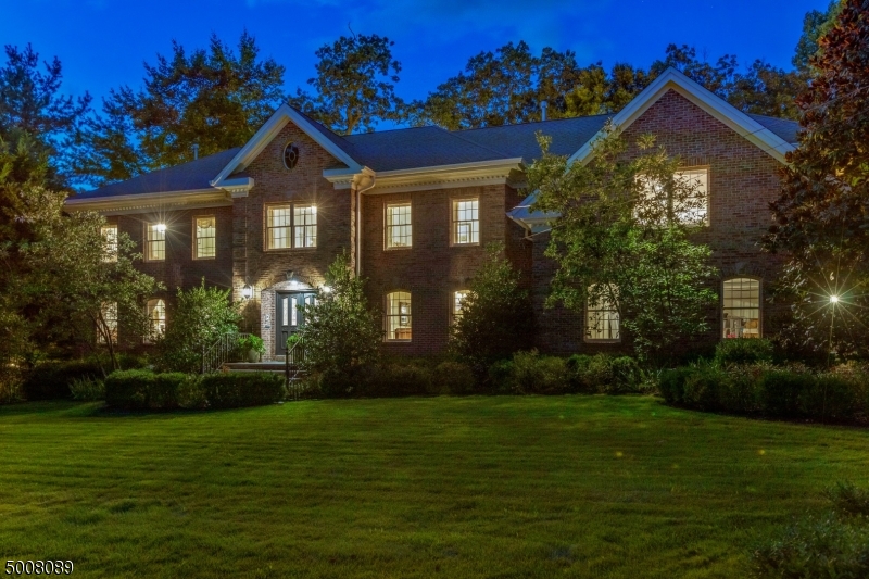 Mint condition All Brick Colonial ideally located on .46 acres of totally level, private, park-like property with a stunning pool walking distance (just .2 miles) to highly rated Deerfield Elementary School! With great natural light, beautiful hardwood floors & a terrific open floor plan, this home is perfect for both entertaining & everyday living! The stunning gourmet eat-in Kitchen is totally open to family room w/ fireplace. Huge master suite features a gas fireplace, 2 walk-in California closets, sliding doors to a private balcony overlooking the pool & spa-like bath with shower & soaking tub. 4 more bedrooms, 2 en suite, complete 2nd level. Beautifully finished walk-out lower level w/ rec room, Nanny's room, game room, exercise room, wine cellar, full bath & laundry room. Luxurious living at its finest!