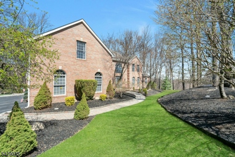 Nestled in the coveted Greenfield Hill Estates of Sparta, this luxurious 4-bedroom, 4.5-bath home offers an unparalleled lifestyle. The grand entryway opens to a stunning living space, featuring a gourmet kitchen with stainless steel appliances, a pantry, and Spanish porcelain tile floors with granite countertops. The spacious primary wing is a retreat, with a large walk-in closet, tray ceilings, a sitting area, and a spa-like bath with a Jacuzzi tub. The formal dining room impresses with tray ceilings and inlay flooring, while a formal living room with French doors flows into a game room with a fireplace and a private office. The family room boasts soaring ceilings and a fireplace, and hardwood floors grace the entire home, along with a central vacuum system. Outside, enjoy a large deck, a fenced-in yard, and a fire pit area with a sound system. Plus, a spacious three-car garage provides ample storage and convenience. Close proximity to all schools, as well as routes 15, 23, 94 only 20 mins. to drive to route 80 plus close proximity to the restaurants and boardwalk at Lake Mohawk. It is only a 25 minute drive to the NJ Transit Train in Dover and a 5 minute drive to the Lakeland bus stop that goes to Port Authority.  Convenience at its best.  Every corner of this home is designed for elegance, comfort, and modern living don't miss your opportunity to make it yours!