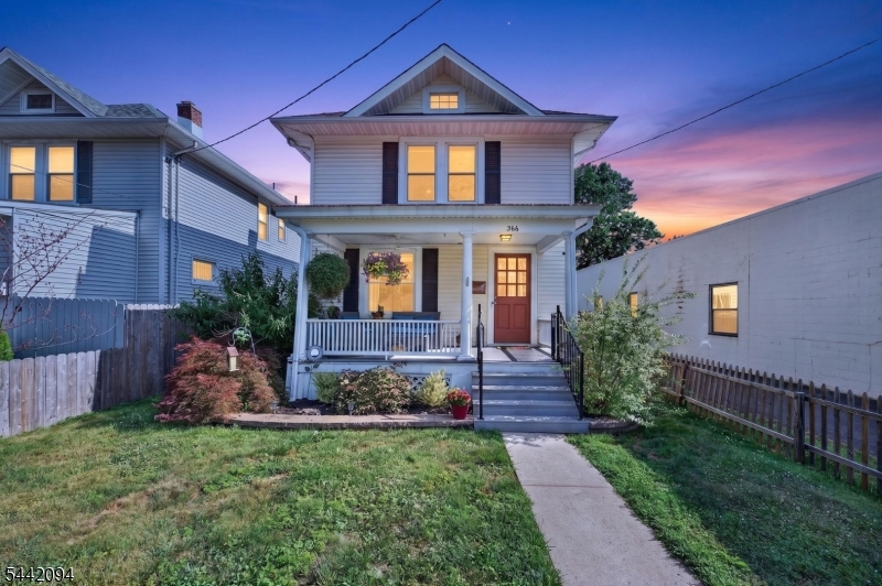 Welcome to this exceptional three-bedroom, 1.5-bath home perfectly positioned near downtown Somerville, offering an ideal blend of vintage charm and modern comfort. This classic frame residence features formal living and dining areas adorned with original hardwood floors and beautiful plaster millwork, creating elegant spaces perfect for entertaining. The kitchen features granite countertops, stainless steel appliances, and flows seamlessly into a delightful sun porch bathed in natural light. The generous master bedroom includes a walk-in closet, while two additional bedrooms provide ample space for growing needs. The full main bath showcases exquisite tilework and a vanity design that adds character throughout. Architectural details include original wood ceiling treatments and a vinyl sided exterior. The basement reveals a full wet bar complete with mini fridge and custom lighting, perfect for entertaining or recreation. Additional storage is easily accessible via pull-down attic stairs. Outside, this property truly shines with two decks, a paver patio featuring a professional-grade grill, and a fully fenced yard anchored by a koi pond. A one-car detached garage and private driveway for convenience. Close to downtown Somerville's vibrant dining, shopping, and cultural attractions with minimal street noise, this location offers walkable access to commuter corridors and excellent schools. An outstanding opportunity for discerning buyers.
