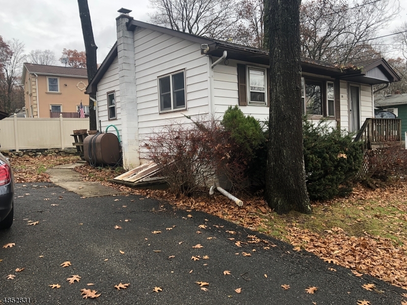 PERFECT STARTER HOME.  WHY RENT?  YOU CAN MAKE THIS YOUR OWN  IF YOU HAVE A VISION AND A HANDY PERSON. CORNER LOT LOCATION IN A TERRIFIC NEIGHBORHOOD! 2 BEDROOM, ONE BATH RANCH WITH DECK AND FULL BASEMENT WITH LAUNDRY ROOM AND WHAT WAS USED AS A THIRD BEDROOM. GREAT OPPORTUNITY WITH A FANTASTIC PRICE FOR AN INVESTOR AS WELL!  LOCATED MINUTES FROM ROUTES 80 AND 46.  HIGHLY MOTIVATED SELLER; PRESENT ALL OFFERS..