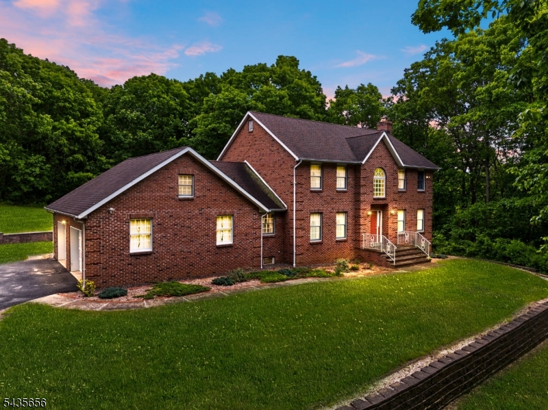 This magnificent, custom-built Colonial is being offered to the market for the very first time, presenting a truly once-in-a-generation opportunity. Masterfully constructed with uncompromising quality and an extraordinary attention to detail, the impressive all-brick estate sits majestically on just under four acres of pristine property surrounded by lush, mature landscaping. Upon entering, you are welcomed by a grand foyer that sets a spacious and elegant tone carried throughout the entire home. The heart of the residence features an expansive, large-sized kitchen that flows seamlessly into a sun-drenched sunroom, offering the perfect space to unwind and take in the scenic views. For accommodations, the home boasts three generously sized bedrooms and three full baths, highlighted by a private primary suite complete with a ensuite bath and a walk-in closet. Complete with a two-car garage, a newer roof for ultimate peace of mind, and a large unfinished basement with tons of potential for future customization, this beautifully maintained estate is ready for its next chapter.