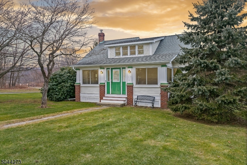 OPPORTUNITY!! 1120 SQFT DETACHED MEGA GARAGE WITH INDUSTRIAL SIZED DOORS AND LOFT SPACE!   IMAGINE THE POSSIBILITIES FOR WORK & STORAGE! THIS SPACIOUS CAPE COD ON A LEVEL CORNER LOT WITH 4 BDRMS, 2 FULL BATHS OFFERS ALL THE CHARM WITH MODERN CONVENIENCES. ORIGINAL WIDE WOOD MOLDINGS & HARDWOOD FLRS, KITCHEN & BATHS ARE UPDATED, NEWER H/W HEATER, FURNACE & A/C INSTALLED IN 2020. PLENTY OF KITCHEN CABINETS, TUMBLED MARBLE BACKSPLASH, CORIAN COUNTERTOPS, COUNTER SEATING AREA  & PANTRY. DINING ROOM OFF KIT OPENS TO THE LIV RM. BONUS/FAM ROOM PROVIDES A GREAT ENTERTAING SPACE.1ST FLR OFFERS 2 BDRMS + BATH,ADDITIONAL 2 BDRMS + FBATH ON 2ND FLR & WALK-IN ATTIC STORAGE.