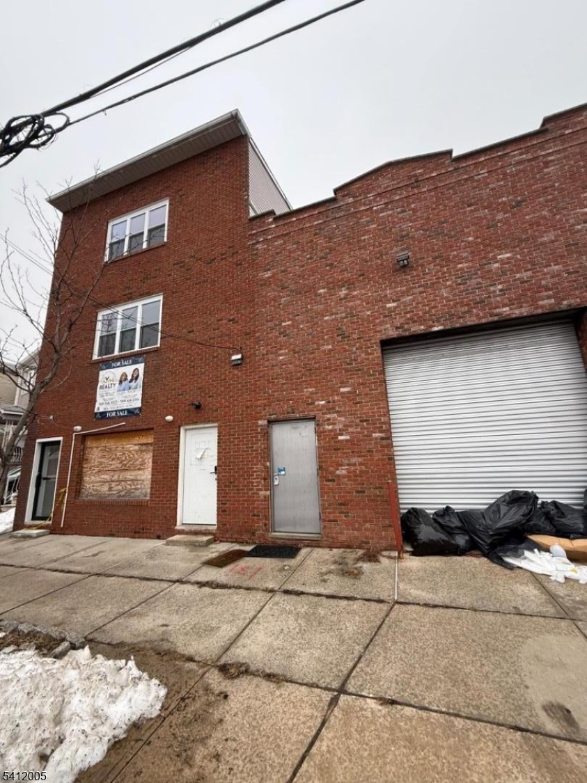 Exceptional investment opportunity featuring a 3,100 sq ft warehouse/storefront situated on a 50x100 lot, 18 ft Ceiling Height. The property also includes two fully renovated 2-bedroom residential apartments above. All units are vacant, offering immediate flexibility for an owner-user or investor to set market rents. The warehouse space provides excellent versatility for retail, light industrial, distribution, or contractor use. Renovated residential units are move-in ready. Ideal for business owners seeking live/work potential or investors looking to maximize income.
