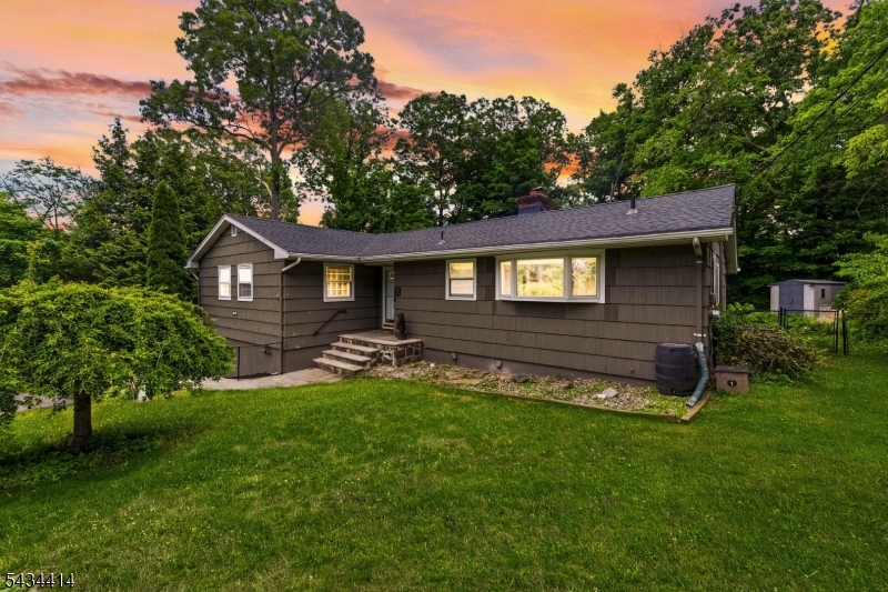 Welcome to your dream lake-community lifestyle in highly sought-after High Crest Lake! This charming ranch-style home perfectly blends modern updates, cozy comfort, and pristine natural surroundings. Inside, an abundance of natural light pours across beautiful hardwood floors spanning the entire main level. The heart of the home features a cozy fireplace in the living room, transitioning into the dining area and a fantastic, sun-drenched sunroom perfect for relaxing. The beautifully updated interior includes a kitchen renovated with sleek stainless steel appliances, three comfortable bedrooms, and two newer, upgraded full baths. Downstairs, a finished walk-out basement drastically expands your living space ideal for a family room, gym, or office with direct access to the yard. A one-car attached garage offers great parking and storage. What truly sets this property apart is the incredible peace of mind from major mechanical updates. The heavy lifting is done with a BRAND-NEW septic system, a new HVAC system installed in 2024, and a new roof from 2023. Beyond your front door, High Crest Lake offers an unparalleled lifestyle with exclusive access to a private beach, community playground, and a local clubhouse. This rare combination of a turn-key ranch and a vibrant lake community makes this home an absolute must-see!