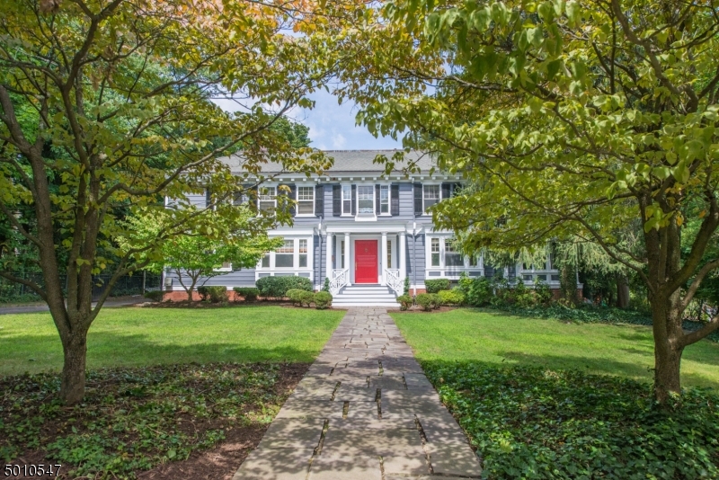 Welcome to 63 Warren Pl, a gracious 1902 center hall Colonial located in the heart of Montclair Estate Section. The home is replete with beautiful period details and filled with modern amenities. The home is replete with beautiful period details and filled with modern amenities. With grand-scaled rooms, hardwood floors throughout & soaring ceilings, this property exudes old-world elegance.  The home boasts 6 beds, 4.5 baths, a breakfast room, sunroom, den & finished basement with an impressive wine cellar. The ample cook's kitchen has mahogany countertops, Sub Zero fridge, Viking 6-burner cooktop, plus 2 wall ovens. Set on nearly 1/2 acre with an inviting wrap-around back porch, it's the perfect home for entertaining or simply to enjoy a relaxing staycation! Just a short walk to downtown Montclair.
