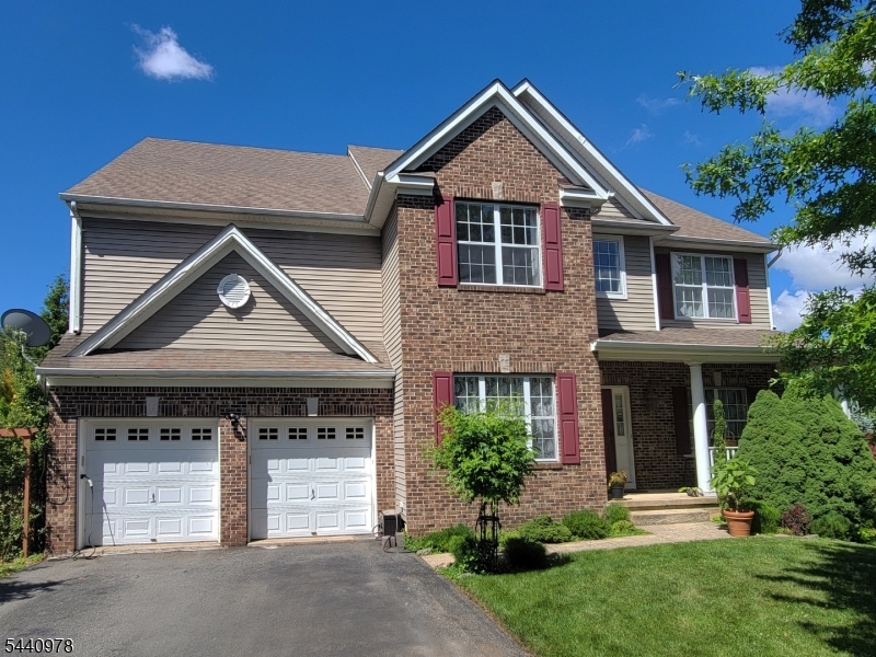 Welcome to this stunning Colonial home in the highly desirable The Peaks community of Lake Hopatcong in Jefferson Twp. Nestled at the beginning of a quiet cul-de-sac, it offers elegance, comfort, & year-round spectacular lake views. Bathed in natural light, it features an open & spacious floor plan designed for everyday living & entertaining. The large open-concept KITCHEN offers a center island, generous dining area, abundant cabinetry, & direct access to a deck w/breathtaking lake views & sunsets. A formal DINING ROOM, LIVING ROOM, & HOME OFFICE provide flexibility for remote work. The impressive FAMILY ROOM showcases a cathedral ceiling & expansive windows, creating an airy & inviting atmosphere. A dual staircase leads to the 2nd floor, enhancing the sense of space & sophistication. Upstairs, the spacious PRIMARY SUITE features 2 walk-in closets & an en-suite BATHROOM w/a jetted tub, oversized shower, & separate water closet. 3 additional BEDROOMS, a full BATHROOM, & a LAUNDRY ROOM complete this level. The walk-out BASEMENT w/SAUNA & GYM offers versatile space for wellness, recreation, & storage. Outside, a beautifully landscaped garden creates a private outdoor oasis. An oversized 2-car GARAGE provides extra storage space. Ideally located w/convenient access to major highways, this home offers an easy commute to NYC. Most furniture & selected household items may be included for a seamless move-in. This is a rare opportunity to own such a spectacular home. A must-see!