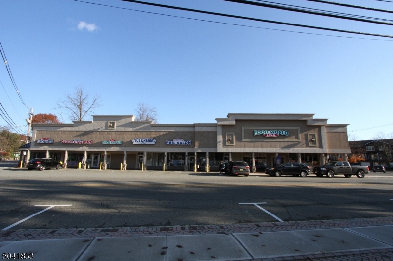 Financing available! Prime location in Central business district. Zoned B-1-A Zone "Commercial". Six store fronts with 1 currently vacant & ready for owner occupant or tenant of buyer's choice. Tenants include Grocery Store of many years (anchor tenant), Nail Salon, Ice Cream Store, Chinese Take-out and Liquor Store. Currently rent role is approx. $210,000. per year without the vacant storefront. Empty storefront was $2,200. per month. Partial basement. Financing is available to qualified buyer with 20% down, 1 point, 15 year fixed at 4.5% or 7 year balloon with rate and term to be negotiated. Present all written offers. 19 parking spaces plus 2 possible in rear of bldg., plus 10 parking spaces in front of building which appear to be mostly on town's land. Also, street parking.