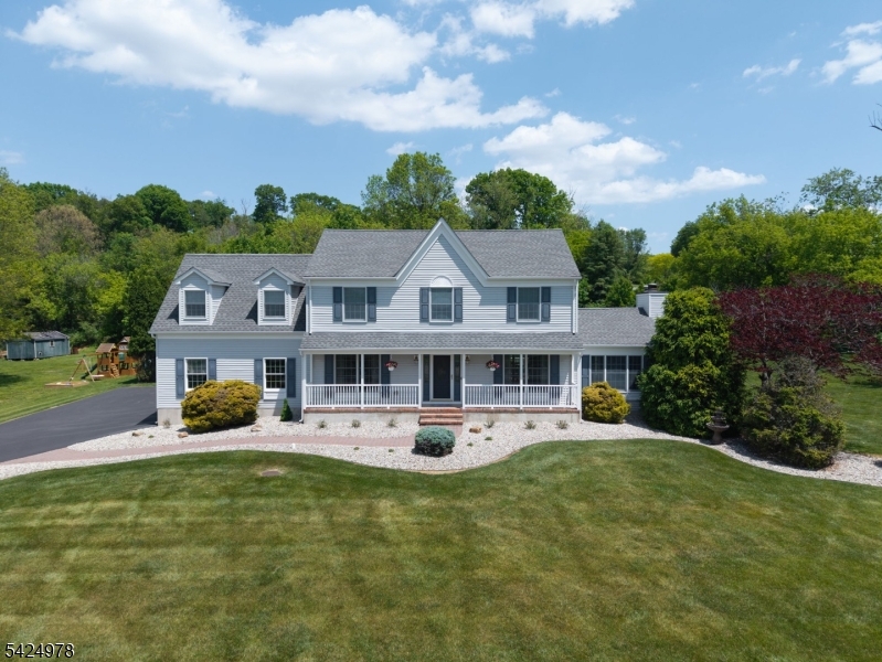 Simply Beautiful 4 BR, 2.5 Bath Col Nestled on a 1.40 Acre Lot within Scenic and Highly Sought After Greenwich Twp! When it comes to Location...this one offers the Best; Literally Just MINUTES to COMMUTER Rts & Most CONVENIENCES yet tucked away within a private tranquil Country Setting! Thoughtfully, Meticulously & Continuously maintained & Upgraded over the years from the time sellers had it built! Paver Walkway! Lovely Landscaping! Welcoming Covered Front Porch! Lovely Entry Foyer w/TILE! Turned Staircase w/solid treads & Black Iron Spindles! CROWN & CHAIR-RAIL Moldings! Gleaming HARDWOOD Floors! Gorgeous Custom Kit with terrific design! Under Cabinet Lighting! All appliances Included! Pella Slider w/built-in blinds! Room with CATHEDRAL and BEAMED Ceiling! Impressive Floor to Ceiling all BRICK Natural Gas FIREPLACE! FRENCH Doors! Updated & TILED Baths! Fabulous 1st Flr Mud Room w/Closet, Sink & GRANITE topped Cabinets! All Spacious BR's! Primary has WALK-IN Closet w/Organizer & EN-SUITE Bath! Fin LL with Rec Rm, Dry Bar, Office & Workshop/Utility Area! (Pool table, Bar, Stools & Fridge Incl'd! 2 Car Gar w/openers! COMPOSITE Deck w/outdoor Speakers! Expansive PAVER PATIO with BUILT-IN BARBEQUE! Two Sheds! Spotlights! Roof-2018! Whole House Water Filter! Sump Pump w/Battery Backup! Nat Gas w/Humidifier & upgraded HEPA Filter! 1.40 Acre Lot Bordered by MATURE TREES providing a NATURAL PRIVACY Barrier! Garden Area! Get Ready to Pack! You Can Finally Say..."Honey, We are HOME!"