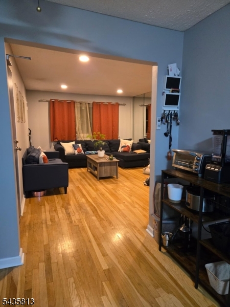 Conveniently situated near Caldwell's vibrant downtown, with easy access to shopping, dining, and NYC-bound bus service. This charming one-bedroom, one-bathroom unit features a spacious living room, an open and airy layout with a connected kitchen, pull-down attic stairs offering additional storage space, on-site laundry, and a garage for added convenience.
