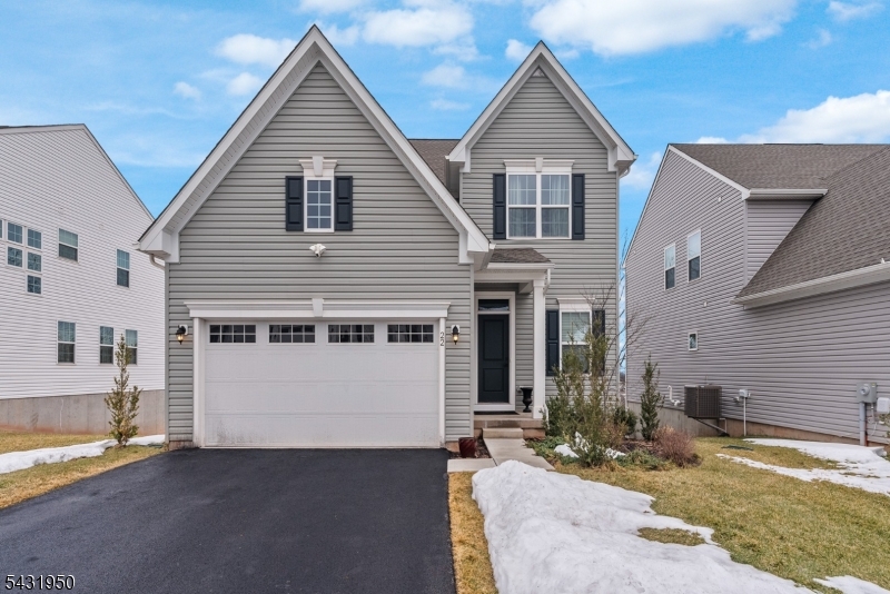 Perryville Ridge, Ryan Homes Ballenger model built in 2023. Bright and airy 3 Brs, 2.5 Bath home on premium lot with stunning views of valley and mountains. Located less than 1 mile from Rt. 78, this home benefits from a country setting and easy highway access. Minutes from downtown Clinton and approximately 30 mins to Bridgewater and Flemington. Open-floor Concept living area, Foyer/Flex room, Kitchen, DR and LR on first floor with woodgrain vinyl flooring throughout.Kitchen features white shaker cabinets, quartz countertops with island seating and GE Profile appliances. Upgrades include glass tile herringbone pattern backsplash in kitchen, gas fireplace, and sliding doors to covered porch. A half bath completes the main level. Second floor consists of Primary Bedroom with two walk-in closets, en-suite bath with double sink and extra large shower. 2 additional BRs and flexible workspace Office/Study (can easily be converted to 4th bedroom) each with large closets, Main Bath with tub, Laundry Room and Linen Closet complete the neutrally carpeted 2nd floor. Walk-out basement with sliding doors to backyard and upgraded with roughed-in plumbing for future bathroom build-out. Home is equipped with On-demand Water Heater, WIFI enabled Smart Thermostat, driveway and backyard facing Ring Flood-lights and is pre-wired for cable and security system. Community amenities: Pickleball Court, Dog Park and Playground. Owner/Seller is a NJ Licensed Real Estate Salesperson.