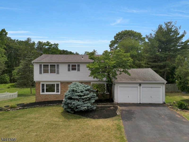 Nestled in a peaceful Franklin Township setting, this 4-bedroom, 2.5-bath Colonial offers space, comfort, and natural beauty. Hardwood floors add warmth and character throughout the home, while the layout includes both a formal living room and a comfortable family room, providing plenty of space for everyday living and entertaining. The eat-in kitchen features a breakfast nook and opens to the family room, creating a welcoming gathering space with views of the beautiful backyard. Upstairs, four bedrooms offer comfortable accommodations, including a primary suite with a private bath. One of the bedrooms features private access to an elevated deck, providing the perfect spot to enjoy your morning coffee or unwind while taking in the peaceful surroundings. Step outside and enjoy your own private retreat. The expansive multi-level deck is perfect for outdoor dining, entertaining, or simply relaxing while taking in the peaceful surroundings. The spacious yard, wooded views, and local wildlife create a true nature lover's paradise. Unlike many homes in the area, this is not a Levitt-built home and features a full unfinished basement offering storage and future finishing potential, including a dedicated photography darkroom. Additional highlights include a two-car attached garage and a location that combines privacy with convenience. If you've been searching for a home that offers privacy, nature, and room to grow, this home deserves a closer look.
