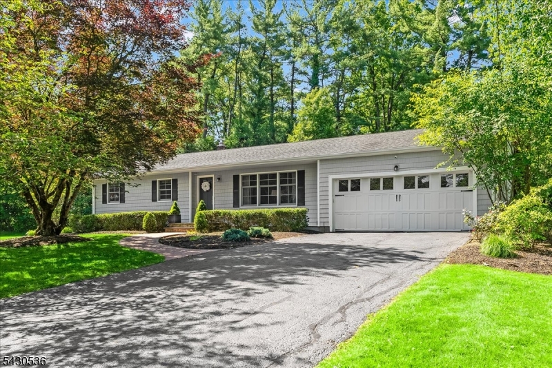 Rarely does a property offer this combination of level acreage, privacy and easy single level living in one of Basking Ridge's most desirable settings. Tucked away on a quiet neighborhood street and set on 1.37 open acres, this move-in ready ranch style home lends itself beautifully to both relaxed everyday living and effortless entertaining. The main level features 3 bedrooms, 2 full baths and convenient first floor laundry. At the center of the home, the thoughtfully designed kitchen is tailored for the serious home chef with double ovens, extensive custom storage, expansive prep areas and an oversized island which anchors the space. French doors from the kitchen and sliding doors from the adjacent living area create a natural connection to the raised stone patio and serene backyard setting. The full lower level offers exceptional flexibility with finished recreation space, office area, full bath, laundry room and abundant storage throughout.