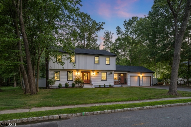 STUNNING, PRISTINE, COMPLETELY RENOVATED (2024 & 2025) 4-BDRM W/ POOL IN CLOSE-TO-EVERYTHING LOCATION! Tucked in a leafy neighborhood, this gorgeous home has light hardwood floors accented by modern light fixtures, stylish wallpapers, crisp moldings & fresh paint throughout. Showstopping 12-foot quartz island w/ seating on both sides is centerpiece of Eat-In Kitchen, which also boasts s/s appliances, new custom vent hood, updated cabinets w/ Benjamin Moore custom color & new hardware, large Pantry, & coffee bar. Incredible indoor/outdoor flow from glass doors that open to brick Patio, fully fenced Back Yard/Pool. Large Dining Room has crown & picture-box moldings, beautiful wallpaper. Sun-filled Living Room boasts red brick wood-burning fireplace, large windows at each end. Immaculate Primary Suite features custom built-in closets, En-Suite Bath has wood vanity, glass-door Shower w/ modern tile surround & rainfall showerhead. 3 additional Bedrooms boast multiple Windows, ceiling fans, great closet space. Full Hall Bath offers wood vanity w/ fluted accents, stone countertop, Shower w/ sliding glass door. On the Lower Level, bright, cheery Recreation Room wows w/ chevron wood-look flooring. Utility /Laundry Room could be updated for more Living Space. Generous Storage throughout. 2-car attached Garage. New Roof & Windows (2025). Ideal location near restaurants, shops, NYC direct bus & more! Top-notch schools. 17 New England Dr is ready for you!
