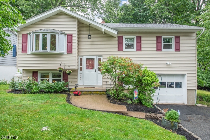 Meticulously Maintained 3 Bedroom 1.5 Bath Bi-level. Nice Curb Appeal. Important upgrades include Roof 5yrs old, Windows & Siding 2020! . This one has beautiful Hardwood Floors throughout the Main Level. Kitchen with Pass Through Open to the Dining Room. Generous Size Walk-Out Family Room to the Fully Fenced in Back Yard and patio! Lower Level Bonus room that can be for Storage or turned into an office. Attached 1 car Garage. Lovely Bow Window in the living Room. Public Sewer!!  Natural Gas coming next year!! Located in the Lake community of beautiful Lake Hopatcong NJ's largest recreational lake. Great solid home ready for its new owner.