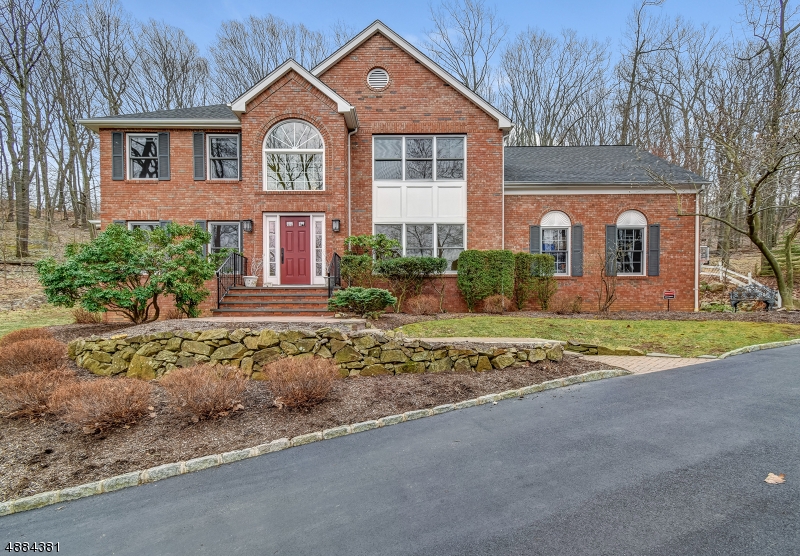 Spacious & bright, brick-front CHC on quiet cul-de-sac minutes from the Morristown Green!  Formal LR & DR with hardwood floors, family room with with fireplace & sliders to deck open to kitchen with breakfast bar, granite countertops, stainless steel appliances, wine frig, powder room & laundry room.  Second floor features a luxury master bedroom with walk in closet, sitting room, and spa-like bath, 3 additional bedrooms & main bath.  Lower level with game room, rec room, storage & full bath.  Nothing to do, just move right in!  Close to town, schools, restaurants, shopping & more!