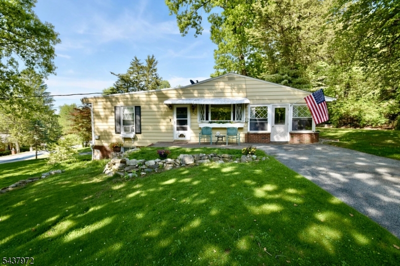 Charming and full of character, this well-maintained Hardyston home offers the perfect blend of comfort, functionality, and privacy. Featuring 2 bedrooms, 2 full bathrooms, and a versatile bonus den, this home provides flexible living space ideal for a home office, guest room, or cozy retreat. The inviting living area is highlighted by a fireplace, creating a warm and welcoming atmosphere year-round. Enjoy peaceful mornings and relaxing evenings in the sunroom overlooking the property's serene surroundings. The thoughtfully designed layout offers comfortable one-floor living, while the attached one-car garage provides added convenience and storage. Situated on a beautifully sized corner lot, this property offers the perfect balance of indoor comfort and outdoor enjoyment!
