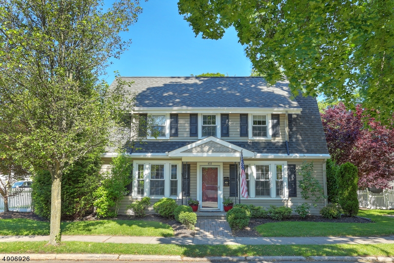 This home is truly perfection both inside and out! Newer kitchen with custom wood cabinets, lighting, granite counters, deep stainless sink, decorative full tile back splash and breakfast bar. Opens into dining room with hard wood floors. Living room with wood burning brick fireplace with wood mantle. Family room with hardwood floors, great entertaining space plus a full bathroom on 1st floor. Second floor consists of hardwood floors, newer full bath, tiled floor with partial tiled walls, light fixtures over vanity, tub with shower and sliding glass doors .Master bedroom  with two separate access doors to bedroom plus two additional bedrooms! Need 4 bedrooms, this can be done! Private back yard area just finishes off this beautiful home. Gas line for hookup for grill To show is definitely to sell.