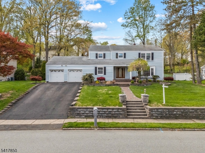 IMMACULATE and SUN DRENCHED!  FRESHLY PAINTED and WELL MAINTAINED! Nestled on over 1/3 acre, this Sun-filled Colonial is sure to impress! Step inside to the main level to be greeted by a welcoming foyer, where you'll find an expansive living room, a formal dining room, a well appointed kitchen with center island, a convenient family room, a den/office, powder room, and laundry room. Upper Level features a spacious primary suite with a walk in closet and lovely full bath. Three additional generous sized bedrooms and a full bath completes this level. Basement level offers a versatile recreation room and a utility room with plenty of storage space. Enjoy seamless indoor-outdoor living with multiple access leading to a large, inviting paver patio and backyard! (PARSIPPANY WITH BOONTON MAILING ADDRESS) DO NOT MISS THE OPPORTUNITY TO MAKE THIS HOUSE YOUR HOME!