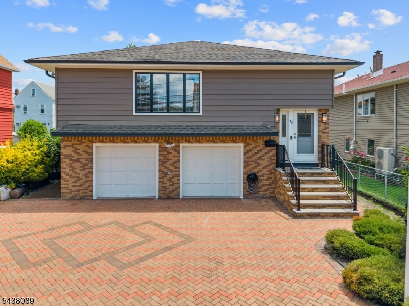 Welcome to this stunning fully renovated home located in the heart of the highly sought-after Athenia section   just minutes from the train station, major highways, shopping, and dining. Completely reimagined with modern elegance and exceptional attention to detail, this move-in-ready home offers the perfect blend of style, space, and versatility.Step inside to discover bright, open-concept living spaces filled with natural light, beautifully updated kitchens and bathrooms, gleaming floors, and designer finishes throughout. Thoughtfully designed for flexible living, the home features a spacious in-law suite complete with a second kitchenette, offering both comfort and privacy while maintaining a warm and inviting atmosphere.Generously sized bedrooms, ample storage, and a beautifully maintained exterior make this property truly stand out. Whether you're looking for additional living space, guest accommodations, or simply a beautifully renovated home in a prime commuter location, this exceptional property checks every box.A rare opportunity to own a turnkey home in one of the area's most convenient and desirable neighborhoods!