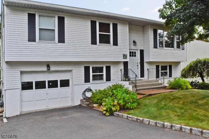 This updated bi-level with an amazing kitchen in Denville is not to be missed. The bright and airy kitchen is open to the formal dining room and is perfect for entertaining. With custom cabinets, ss appliances, granite counters, center island, and plenty of natural light it is a true masterpiece. The first floor has hardwood floors throughout, including the three bedrooms each with ample storage space. The ground floor offers a large family room with a full bath and sliders with access to the deck and backyard. Completing the ground floor is a home office perfect for anyone looking for private space to work from home. Less then a mile from downtown Denville's shops and restaurants and handy to the Midtown Direct Train this home is not to be missed.