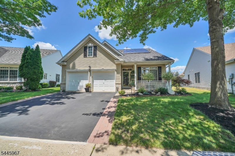.Welcome to this inviting ranch-style single-family home that offers easy accessibility to all areas of this home. It features 2 spacious bedrooms and 2 full bathrooms. Designed for comfort and convenience, this property includes a 2-car garage equipped with a heater to use for workshop Hardwood Floors throughout adding warmth and timeless elegance to every room. Bright Sunroom space that can be used as an extra bedroom, office, or relaxation area, with direct access to the backyard. Solar Panels that are equipped with netting to prevent bird nesting, contribute to energy efficiency and sustainability. Tesla Car Charger for your electric vehicle, making it convenient to charge at home with Tesla backup power wall for added backup capacity to ensure you remain powered even during outages. New Roof with Warranty: Ensures peace of mind and protection from the elements. New HVAC System, Hot Water Heater, April Air Humidifier: Helps maintain a comfortable humidity level, enhancing indoor air quality. Large porch is a perfect spot to enjoy your morning coffee while taking in the serene surroundings. New Landscaping and Exterior Painting: Provides a fresh, modern look to the property. Heated garage, with an epoxy-finished floor and insulated door. This home combines modern features with cozy charm, making it an ideal retreat for those seeking comfort and functionality. ***The seller offers a $50,000 payoff for the solar panels or a credit toward the purchase price***