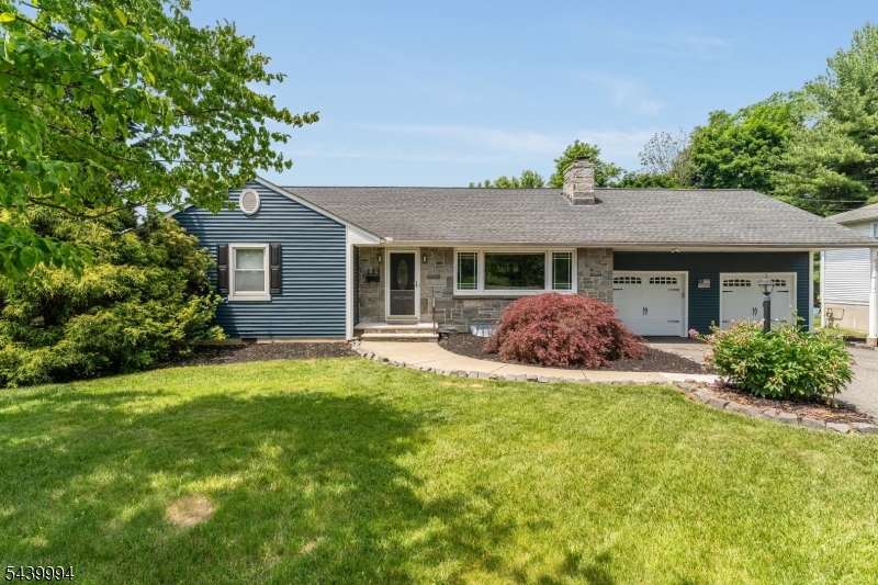 Pride of ownership shines throughout this beautifully expanded and meticulously maintained four-bedroom Ranch situated on a desirable corner lot. Move-in ready and filled with character, this home features a spacious living room highlighted by a stunning stone wood-burning fireplace and hardwood floors that extend through the living room and the bedrooms. The eat-in kitchen offers an abundance of wood cabinetry and counter space, stainless steel appliances, recessed lighting, and a charming stained-glass illuminated cabinet. Three bedrooms are conveniently located on the main level along with a full bath featuring a tiled walk-in shower and separate soaking tub. An additional half bath on the first floor provides added convenience. Just off the kitchen, you'll find access to the full basement with laundry area, offering potential for a future recreation room. Above the attached garage is a finished fourth bedroom with bonus room and its own half bath, making it ideal for guests, a home office, or private retreat. Additional attic storage is also available. Step through the sliding doors to the paver patio overlooking the beautifully fenced backyard complete with a fire pit perfect for entertaining or relaxing. Additional highlights include public water, public sewer, and natural gas. Conveniently located near major commuting routes, shopping, restaurants, and everyday amenities. This exceptional home offers the perfect combination of comfort, character, and convenience