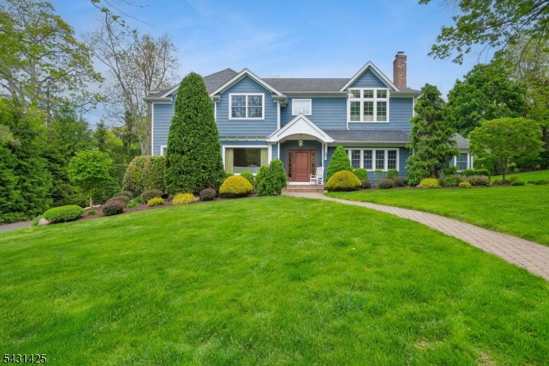 Highly sought after POETS section 6 BR,4.2 bath center colonial with ideal layout of 1st floor bedroom suite on .37 acre lot.Hardwood floors throughout.Gorgeous White custom kitchen w/natural Quartzite counters,center island,separate breakfast area & luxury appliances including 36"Subzero refrigerator,36"separate Subzero freezer,Wolf cooktop,double oven,warming drawer&more.PERFECT floor plan as kitchen opens to window filled family room w/fireplace and natural light. A butler pantry with bar has wine & bev fridges,At hub of the home is a central office space, a powder room and second bedroom on this level. Indoor-outdoor entertaining is made easy with doors to the patio & outdoor kitchen. Second level offers a foyer into huge primary bedroom suite w/high ceilings and TWO walk-in closets. The en-suite spa bath has a claw foot soaking tub, separate shower with glass door, Toto commode& oversized sink in a custom built vanity. The upstairs den is a great room to watch tv or game nights.Two additional large bedrooms all w/walk in closets and sliding barn style doors share a hall bath with double sinks &shower. The 4th BR on this level is EN-SUITE with a private bath. Lower level is a great space for play w/new carpet,mudroom entrance with  built ins perfect for leashes,backpacks &shoes!The full gym offers two rooms for exercising.The laundry &half bath complete this level.This home is ideally located close to Hartshorn Elementary,Gero Park,Short Hills Mall and NYC transportation.